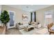 Inviting living room with a comfortable sectional sofa, modern decor, and natural light at 16933 W Bronco Trl, Surprise, AZ 85387