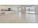 Open-concept living space featuring tile floors, sliding glass doors to the backyard, and an abundance of natural light at 16933 W Bronco Trl, Surprise, AZ 85387