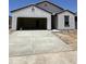 Charming single-story home featuring stucco siding, an attached two-car garage, and a concrete driveway at 1960 E Bucking Bronco Dr, San Tan Valley, AZ 85140