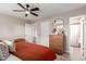 Bedroom with a wooden dresser and a view into the bathroom at 2821 E Larkspur Dr, Phoenix, AZ 85032