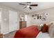 Bedroom features wood dresser with framed photos and comfortable decor at 2821 E Larkspur Dr, Phoenix, AZ 85032