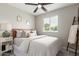 Bedroom with wood accents, cozy decor, and a view of the backyard through the window at 2821 E Larkspur Dr, Phoenix, AZ 85032
