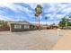 Charming home with desert landscaping and sidewalk on a sunny day showing excellent curb appeal at 2821 E Larkspur Dr, Phoenix, AZ 85032