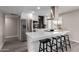 Bright kitchen with white cabinets, stainless steel appliances, large island with breakfast bar seating at 2821 E Larkspur Dr, Phoenix, AZ 85032
