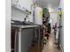 Utility room with washer, dryer, shelving, and various stored household items at 2821 E Larkspur Dr, Phoenix, AZ 85032