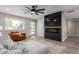 Comfortable living room featuring a modern fireplace, a seating area, and a stylish, open-concept layout at 2821 E Larkspur Dr, Phoenix, AZ 85032