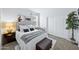 Cozy bedroom featuring ample natural light, slider closet doors, and stylish decor at 31051 W Amelia Ave, Buckeye, AZ 85396