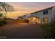 Backyard at sunset featuring a covered patio with view of the home's exterior at 32347 N Vernal Ln, San Tan Valley, AZ 85144