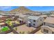 Well-maintained backyard featuring a large play set, trampoline, and ample space for outdoor activities at 32347 N Vernal Ln, San Tan Valley, AZ 85144