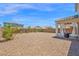 Spacious backyard with a covered patio perfect for relaxing and entertaining outdoors at 32347 N Vernal Ln, San Tan Valley, AZ 85144
