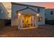 Covered patio features dining and draped curtains, accessible from the interior living space at 32347 N Vernal Ln, San Tan Valley, AZ 85144