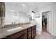 Bright bathroom features a double sink vanity with granite counters and a walk in closet at 32347 N Vernal Ln, San Tan Valley, AZ 85144