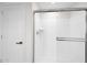 Modern bathroom features an enclosed glass shower, tile surround, and brushed metal shower hardware at 32347 N Vernal Ln, San Tan Valley, AZ 85144