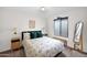 Neutral bedroom with a comfortable bed, stylish furnishings, and a bright window at 32347 N Vernal Ln, San Tan Valley, AZ 85144
