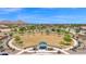 Enjoyable community green area featuring a covered picnic area and lush landscaping, ideal for gatherings and outdoor fun at 32347 N Vernal Ln, San Tan Valley, AZ 85144