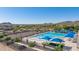 Community pool features umbrellas, desert landscaping, and mountain views at 32347 N Vernal Ln, San Tan Valley, AZ 85144