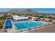 Community pool boasts lap lanes, umbrellas, recreation areas, and a clubhouse for residents' enjoyment at 32347 N Vernal Ln, San Tan Valley, AZ 85144
