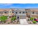 Beautiful home with a well-manicured lawn, a two-car garage and attractive landscaping at 32347 N Vernal Ln, San Tan Valley, AZ 85144