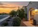 Inviting front entrance with desert landscaping and charming details, leading to a cozy home at 32347 N Vernal Ln, San Tan Valley, AZ 85144