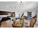 Spacious open-concept living area with a modern kitchen, stylish dining space, and comfortable seating at 32347 N Vernal Ln, San Tan Valley, AZ 85144