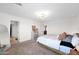 Bright main bedroom features a comfortable bed, neutral tones, and ample closet space, creating a relaxing retreat at 32347 N Vernal Ln, San Tan Valley, AZ 85144