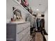 Spacious walk-in closet includes custom shelves and storage options for clothing and accessories at 32347 N Vernal Ln, San Tan Valley, AZ 85144