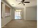 Large bedroom with sliding glass doors to the patio and large windows allowing for plenty of light at 33506 N 24Th Dr, Phoenix, AZ 85085