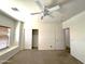 Spacious bedroom with window seat, closet and ceiling fan at 33506 N 24Th Dr, Phoenix, AZ 85085