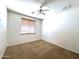 Bright bedroom with ceiling fan and window bringing in natural light at 33506 N 24Th Dr, Phoenix, AZ 85085