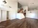 Open living area with wood-look flooring and a staircase to the second floor at 33506 N 24Th Dr, Phoenix, AZ 85085