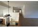 View of upstairs loft with fireplace and living room below, showcasing an open floorplan design at 33506 N 24Th Dr, Phoenix, AZ 85085
