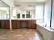 Bright main bathroom boasts a double vanity, soaking tub, and ample counter space at 33506 N 24Th Dr, Phoenix, AZ 85085