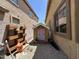 Side yard features a small playhouse with a painted wood plank door at 33506 N 24Th Dr, Phoenix, AZ 85085