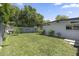 Spacious backyard featuring a large grassy area and mature trees at 3402 E Sells Dr, Phoenix, AZ 85018