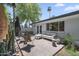 Private backyard patio with stylish outdoor seating and lush desert landscaping at 3402 E Sells Dr, Phoenix, AZ 85018