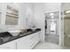 Modern bathroom with double sinks, sleek countertops, and a glass shower at 3402 E Sells Dr, Phoenix, AZ 85018
