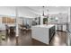 Open-concept kitchen featuring a large island with counter seating and stainless steel appliances at 3402 E Sells Dr, Phoenix, AZ 85018
