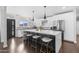 Modern kitchen featuring a large island with counter seating, stainless steel appliances, and modern finishes at 3402 E Sells Dr, Phoenix, AZ 85018