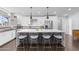 Contemporary kitchen featuring a large island with counter seating and modern appliances at 3402 E Sells Dr, Phoenix, AZ 85018