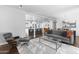 Open-concept living room features modern furnishings and a stylish accent rug at 3402 E Sells Dr, Phoenix, AZ 85018