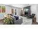 Modern living room featuring a fireplace, comfortable seating, and access to a patio at 3402 E Sells Dr, Phoenix, AZ 85018
