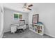 Bright home office with a modern desk and ample storage space at 3402 E Sells Dr, Phoenix, AZ 85018