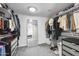 Large walk-in closet with ample storage and mirror at 3402 E Sells Dr, Phoenix, AZ 85018