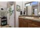 Cozy bathroom with a quirky shower curtain, vanity, and decorative art at 35108 N 139Th Way, Scottsdale, AZ 85262