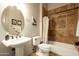 Bathroom with a pedestal sink, tile floors, and a shower-tub combo at 35108 N 139Th Way, Scottsdale, AZ 85262