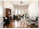 Bright exercise room with a ceiling fan, wood floors, an exercise machine, and natural light at 35108 N 139Th Way, Scottsdale, AZ 85262