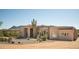 Gorgeous front elevation with manicured desert landscaping and ample shade at 35108 N 139Th Way, Scottsdale, AZ 85262