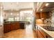 Bright kitchen featuring tiled floors, granite countertops, and modern appliances at 35108 N 139Th Way, Scottsdale, AZ 85262