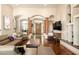 Open-concept living room with archways, wood floors, and comfortable seating at 35108 N 139Th Way, Scottsdale, AZ 85262