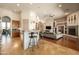 Open-concept layout with kitchen, breakfast bar, and modern living room furniture at 35108 N 139Th Way, Scottsdale, AZ 85262